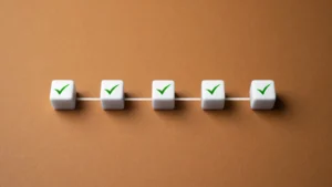 Five white cubes that have check marks on it