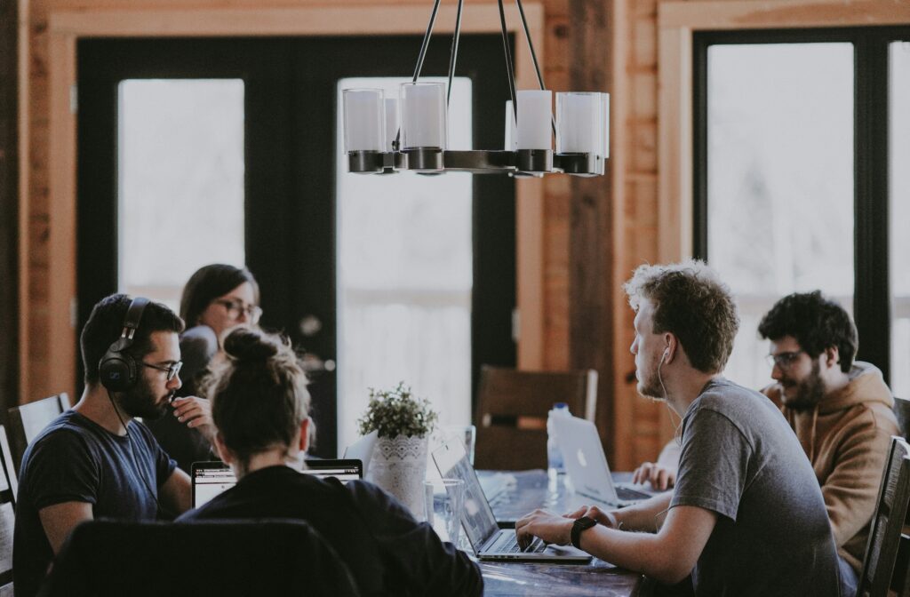 People sitting around a meeting table